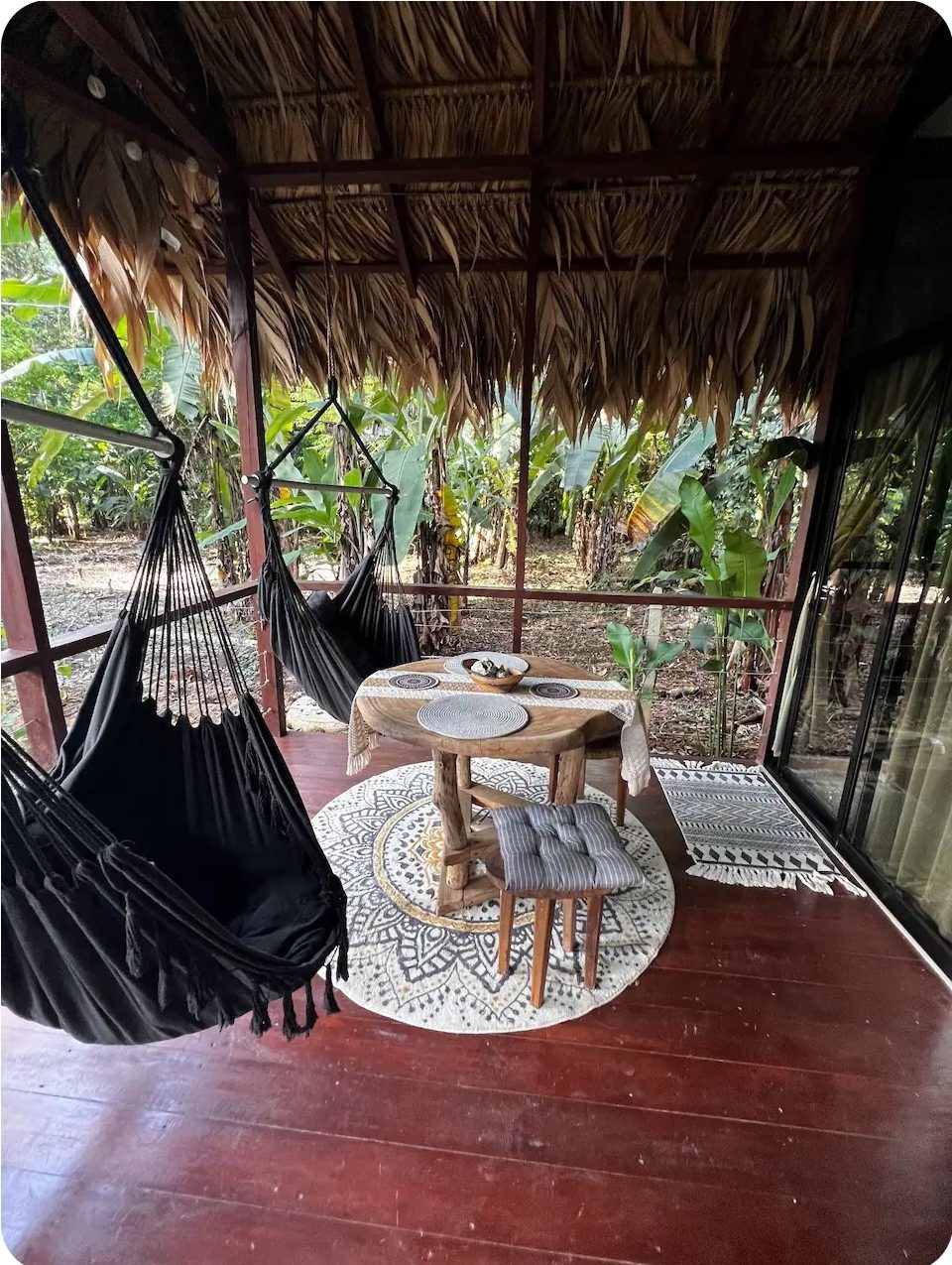 Hammock chair and small table on the bungalow deck
