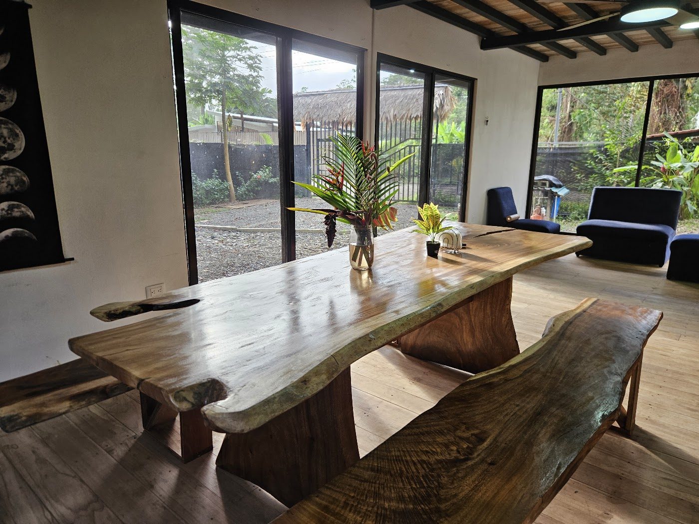 Long live-edge wooden dining table seating the whole group